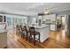 Large kitchen with white cabinets, granite island, and stainless steel appliances at 102 Flud St, Summerville, SC 29483