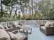 Spacious deck with wicker furniture and wooded views at 102 Flud St, Summerville, SC 29483