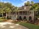Two-story home with a wrap-around porch and manicured landscaping at 102 Flud St, Summerville, SC 29483