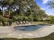 Freeform pool with lounge chairs and umbrella at 102 Flud St, Summerville, SC 29483