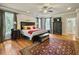Bright bedroom with hardwood floors, large windows, ceiling fan, and ample storage at 102 Flud St, Summerville, SC 29483