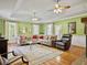 Comfortable living room with hardwood floors, a fireplace, and a large sectional sofa at 102 Flud St, Summerville, SC 29483
