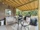 Outdoor kitchen area with sink, grill, and seating at 102 Flud St, Summerville, SC 29483