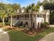 Two-story home with wrap-around porch and palm trees at 102 Flud St, Summerville, SC 29483