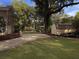 Landscaped backyard with shed and driveway at 102 Flud St, Summerville, SC 29483