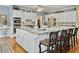 Elegant kitchen with white cabinets, granite island, and stainless steel appliances at 102 Flud St, Summerville, SC 29483