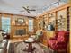 Living room with hardwood floors, fireplace, built-in shelving, and comfortable seating at 102 Flud St, Summerville, SC 29483