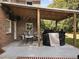 Covered patio with string lights, grill, and seating area at 102 Flud St, Summerville, SC 29483