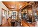 Spacious dining room with a grand wooden table and fireplace at 4239 Tom Point Rd, Hollywood, SC 29449