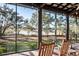 Relaxing screened porch overlooking peaceful water views at 4239 Tom Point Rd, Hollywood, SC 29449