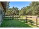 Open pasture with wooden fence and gate at 4239 Tom Point Rd, Hollywood, SC 29449