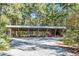 Large open-air pavilion shaded by trees, perfect for outdoor gatherings at 4239 Tom Point Rd, Hollywood, SC 29449