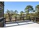 Spacious rooftop deck with views of marsh and trees at 4239 Tom Point Rd, Hollywood, SC 29449