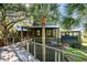 Elevated wooden deck with railing overlooking lush landscape at 4239 Tom Point Rd, Hollywood, SC 29449