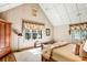 Bright bedroom with high ceilings, hardwood floors, and large windows at 4239 Tom Point Rd, Hollywood, SC 29449