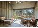Relaxing sunroom with wicker furniture and scenic views at 4239 Tom Point Rd, Hollywood, SC 29449