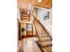 Wooden staircase with railing, leading to upper level at 4239 Tom Point Rd, Hollywood, SC 29449