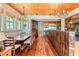 Open kitchen with island, breakfast area, and hardwood floors at 4239 Tom Point Rd, Hollywood, SC 29449