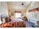 Spacious bedroom with high ceilings, a ceiling fan, and large windows at 4239 Tom Point Rd, Hollywood, SC 29449