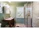 Bathroom with a walk-in shower and pedestal sink at 4239 Tom Point Rd, Hollywood, SC 29449
