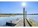 Floating dock with lift and pilings on calm waters at 4239 Tom Point Rd, Hollywood, SC 29449