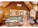 Cozy sitting area with wood-paneled walls and wood floors at 4239 Tom Point Rd, Hollywood, SC 29449