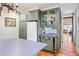 Kitchen features custom green cabinetry and built-in bar at 4239 Tom Point Rd, Hollywood, SC 29449