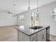 Kitchen island with granite countertop and stainless steel sink at 8735 Revival Rd, North Charleston, SC 29420