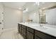 Modern bathroom with double vanity, large mirror, and walk-in shower at 112 Canewood Ln, Ridgeville, SC 29472