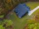 House with a large backyard surrounded by trees at 112 Canewood Ln, Ridgeville, SC 29472