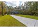 House with a long driveway and a large front yard at 112 Canewood Ln, Ridgeville, SC 29472