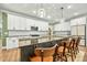Modern kitchen with large island and white cabinets at 112 Canewood Ln, Ridgeville, SC 29472