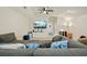 Spacious bonus room features a large sectional sofa and TV, perfect for entertainment at 112 Canewood Ln, Ridgeville, SC 29472