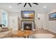 Cozy living room features a fireplace, large TV, and unique coffee table at 112 Canewood Ln, Ridgeville, SC 29472