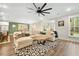 Spacious living room with sectional sofa and hardwood floors at 112 Canewood Ln, Ridgeville, SC 29472