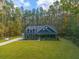 Aerial view of a house nestled in a wooded area at 112 Canewood Ln, Ridgeville, SC 29472