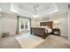 Spacious main bedroom with carpeted floors and a large wooden bed frame at 112 Canewood Ln, Ridgeville, SC 29472