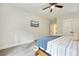 Serene bedroom with a wooden bed frame and wall-mounted TV at 112 Canewood Ln, Ridgeville, SC 29472