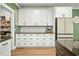 White shaker cabinets, granite countertops, and stainless steel appliances at 112 Canewood Ln, Ridgeville, SC 29472