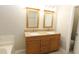 Double vanity bathroom with granite countertop and large mirrors at 110 Smithfield Ave, Summerville, SC 29485