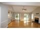 Spacious living room with hardwood floors, fireplace, and access to backyard at 110 Smithfield Ave, Summerville, SC 29485