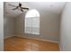 Bright bedroom featuring hardwood floors and an arched window at 110 Smithfield Ave, Summerville, SC 29485