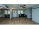 Open living room with wood-look floors and view of kitchen at 565 Estates Dr, Walterboro, SC 29488