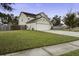 Two-story house with a two-car garage and fenced yard at 174 Education Blvd, Ladson, SC 29456