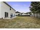 Large backyard with fenced perimeter, patio, and grassy area at 174 Education Blvd, Ladson, SC 29456