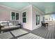Relaxing deck with grey colored floor and wicker furniture, offering scenic views at 2312 Bucktail Ct, Mount Pleasant, SC 29466
