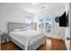 Bedroom with gray platform bed, hardwood floors, and access to a balcony at 2312 Bucktail Ct, Mount Pleasant, SC 29466