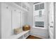 White mudroom with bench seating, hooks, and built-in shelving at 2312 Bucktail Ct, Mount Pleasant, SC 29466