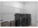 Laundry room with two black Samsung washers and dryers at 2312 Bucktail Ct, Mount Pleasant, SC 29466