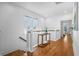 Upstairs hallway with hardwood floors and white railings at 2312 Bucktail Ct, Mount Pleasant, SC 29466